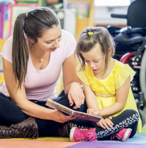 Paraeducator working with student